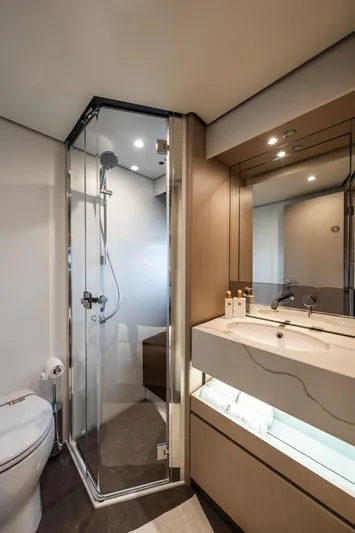  Yacht Photos Pics Luxurious bathroom in 2023 Azimut Fly 68 yacht with modern shower and sleek vanity.