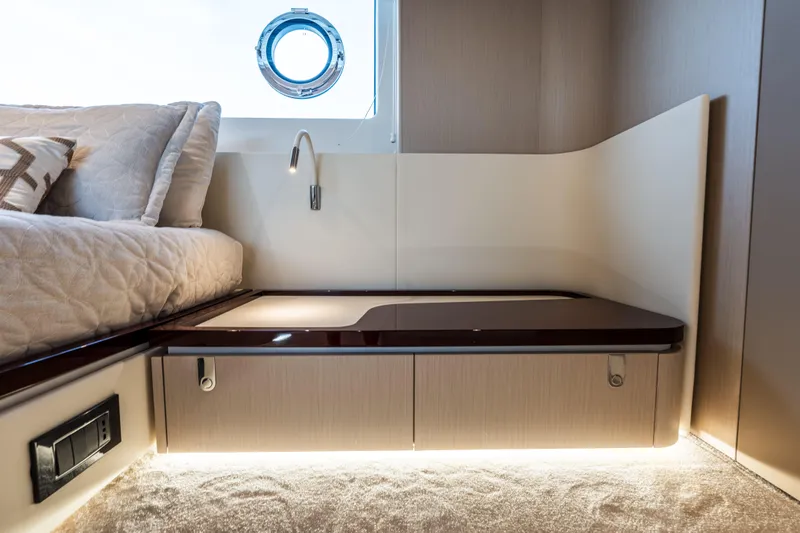  Yacht Photos Pics Luxurious interior of 2023 Azimut Fly 68 yacht with elegant bed and ambient lighting.