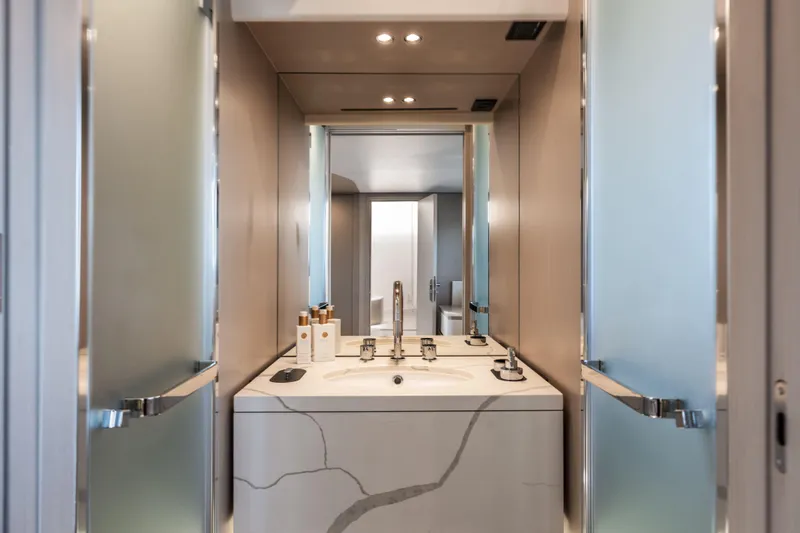  Yacht Photos Pics Luxurious bathroom in 2023 Azimut Fly 68 yacht with modern fixtures and elegant design.