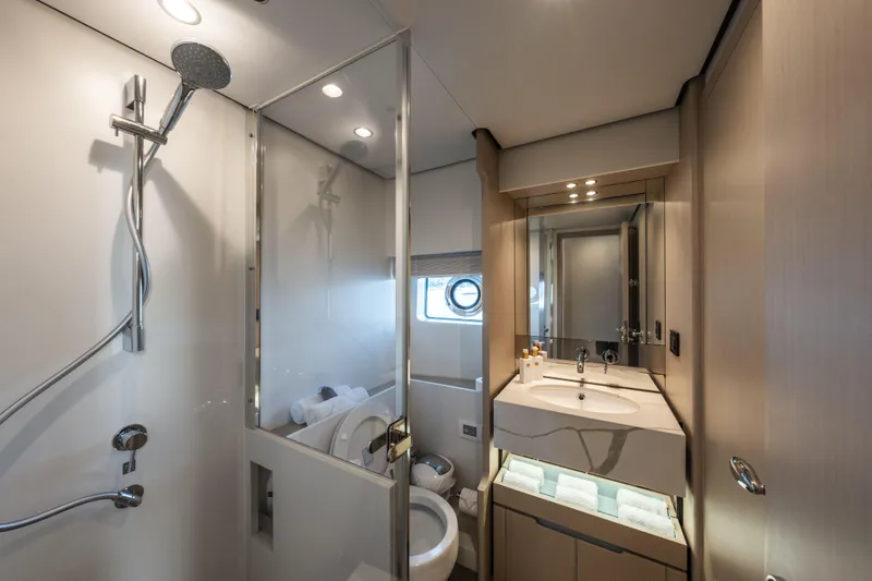 Yacht Photos Pics Luxurious bathroom in 2023 Azimut Fly 68 yacht, featuring modern fixtures and elegant design.