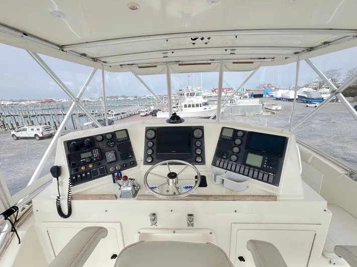 Kemo Sabe Yacht Photos Pics Cockpit view of a 1981 Bertram 45 Convertible yacht with navigation instruments.