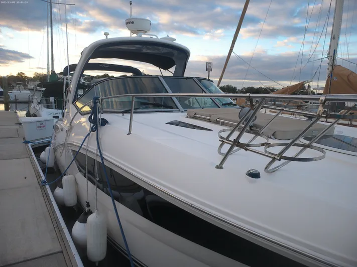 Stella Nautica Yacht Photos Pics 2015 Sea Ray 330 Sundancer docked at marina under cloudy sky.