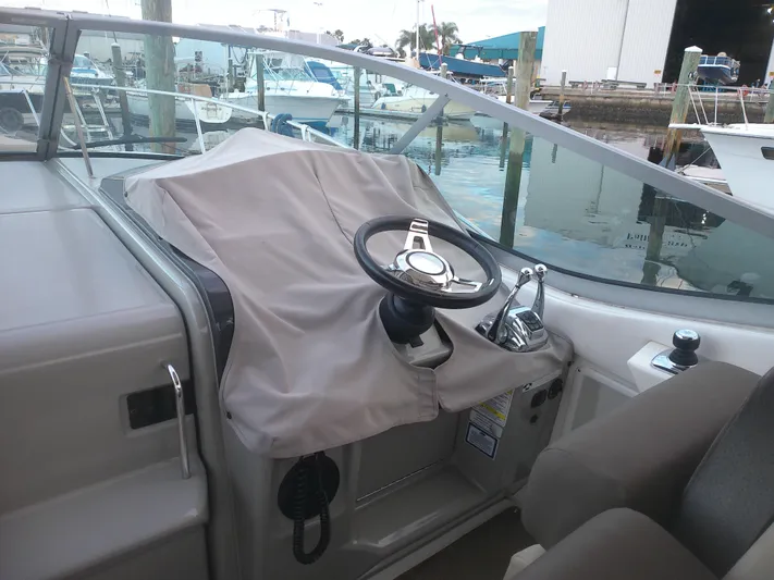 Stella Nautica Yacht Photos Pics Helm of 2015 Sea Ray 330 Sundancer boat docked at marina.