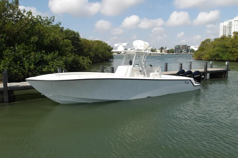 Seavee 340z Yacht Photos Pics 2022 SeaVee 340Z boat docked in a serene waterfront setting.