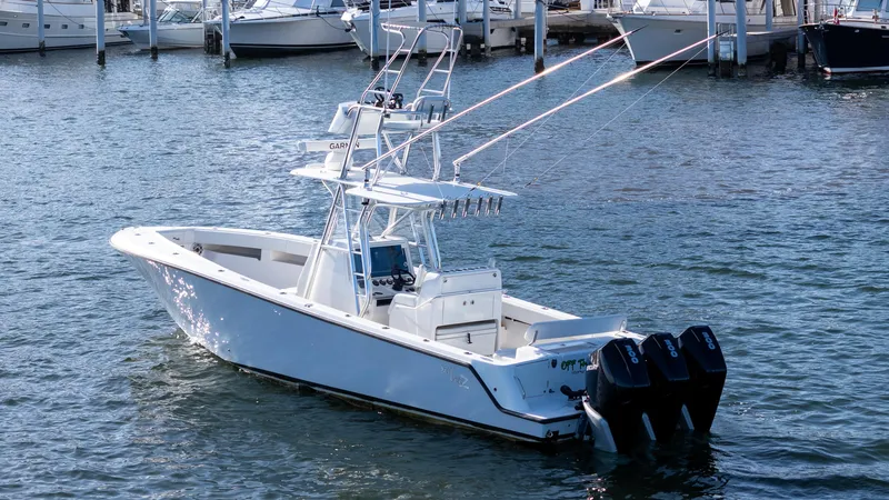 Seavee 340z Yacht Photos Pics 2022 SeaVee 340Z boat with triple engines docked in a marina.