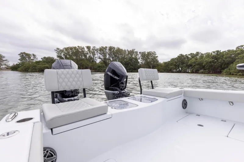  Yacht Photos Pics 2024 Freeman 28 boat with Mercury engines on a calm lake.