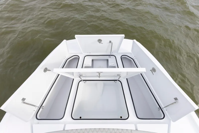  Yacht Photos Pics 2024 Freeman 28 boat storage compartments open on the deck.