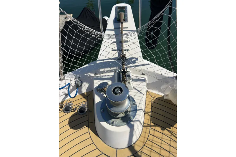 Kailani Yacht Photos Pics Bow of 1991 Viking 63 Motor Yacht with anchor winch and safety netting.