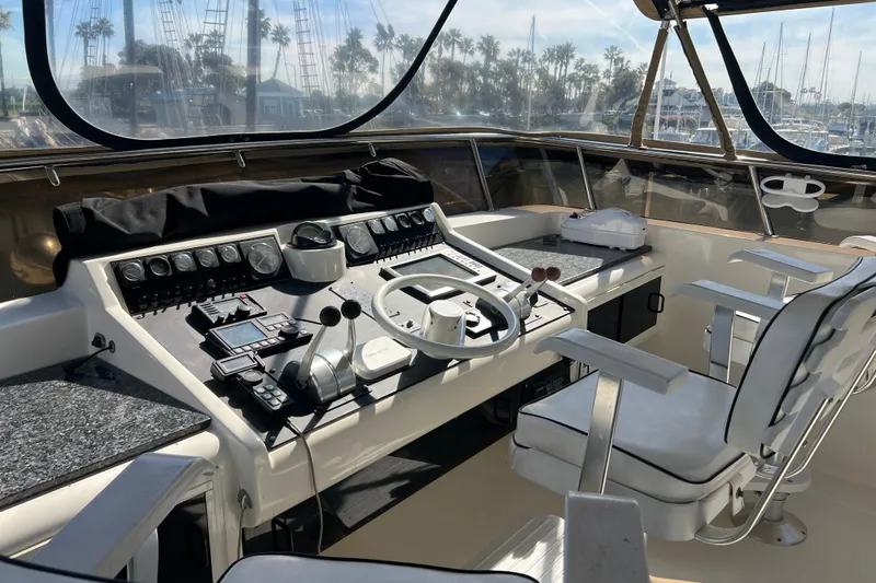 Kailani Yacht Photos Pics Cockpit of 1991 Viking 63 Motor Yacht with steering wheel and control panel.