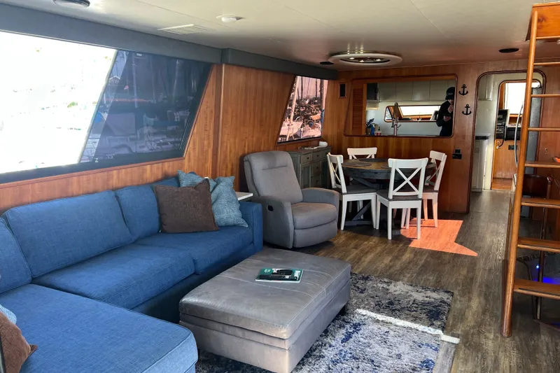 Kailani Yacht Photos Pics Luxurious interior of 1991 Viking 63 Motor Yacht with modern furnishings and wooden accents.