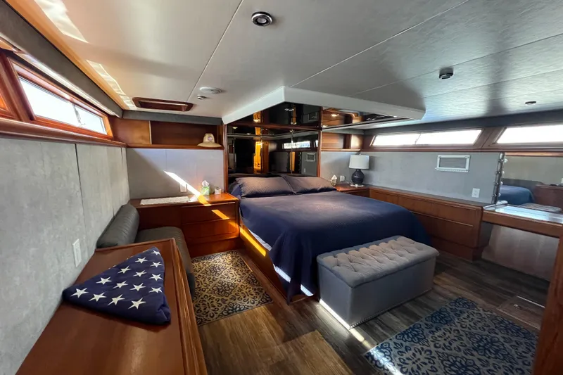 Kailani Yacht Photos Pics Master stateroom with walkaround King bed wit elegant wood finishes.