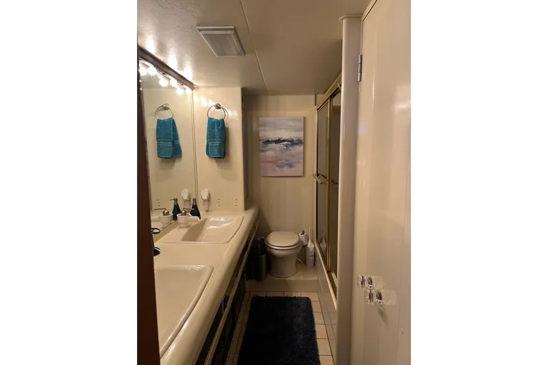 Kailani Yacht Photos Pics Master Bathroom with dual sinks and modern decor. Full tub and shower