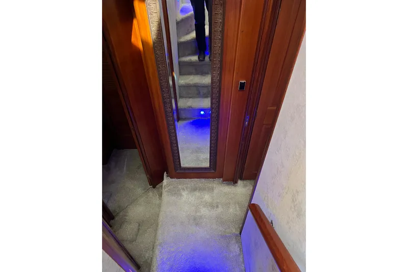 Kailani Yacht Photos Pics Hallway to guest suites - mirror and carpeted stairs.