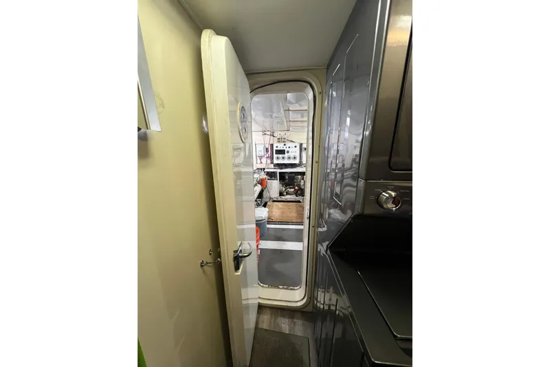 Kailani Yacht Photos Pics Interior view of engine room through open door.