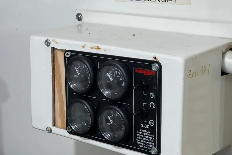 Kailani Yacht Photos Pics Control panel of a 1991 Viking 63 Motor Yacht with gauges and switches.