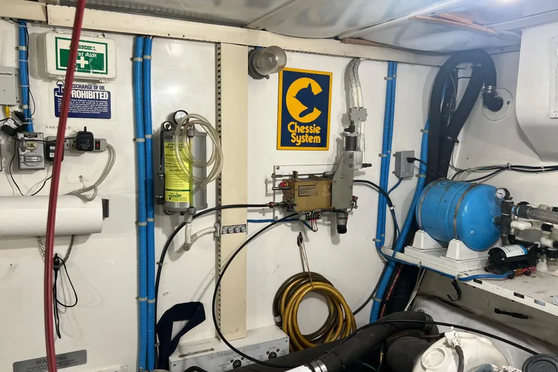 Kailani Yacht Photos Pics aft engine room wall with throttle controls and hydrolic cylinders