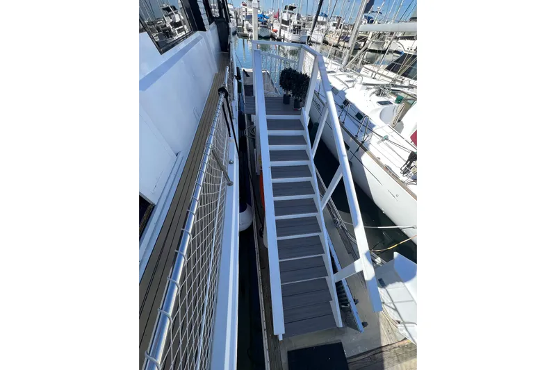 Kailani Yacht Photos Pics Stairway on 1991 Viking 63 Motor Yacht docked at marina.