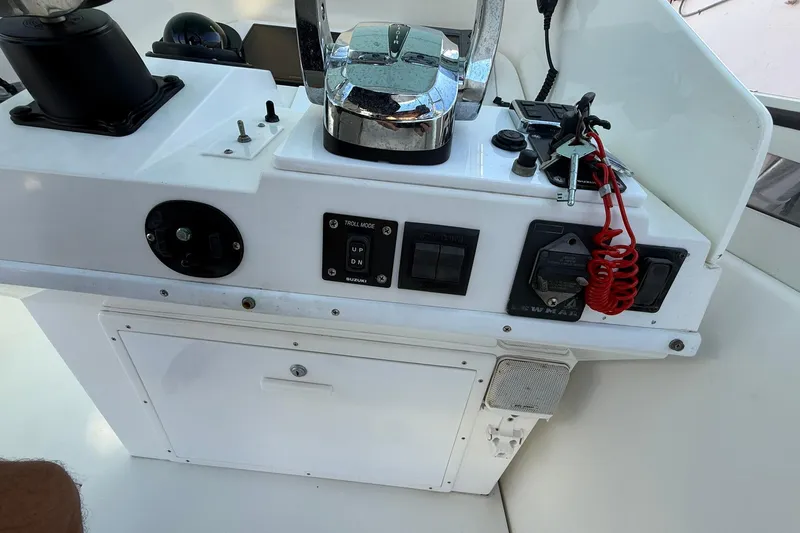 Reel Dreamz Yacht Photos Pics 1998 Contender 35 Express boat control panel with switches and throttle.