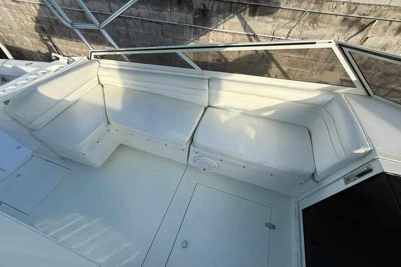 Reel Dreamz Yacht Photos Pics 1998 Contender 35 Express boat with white cushioned seating area.