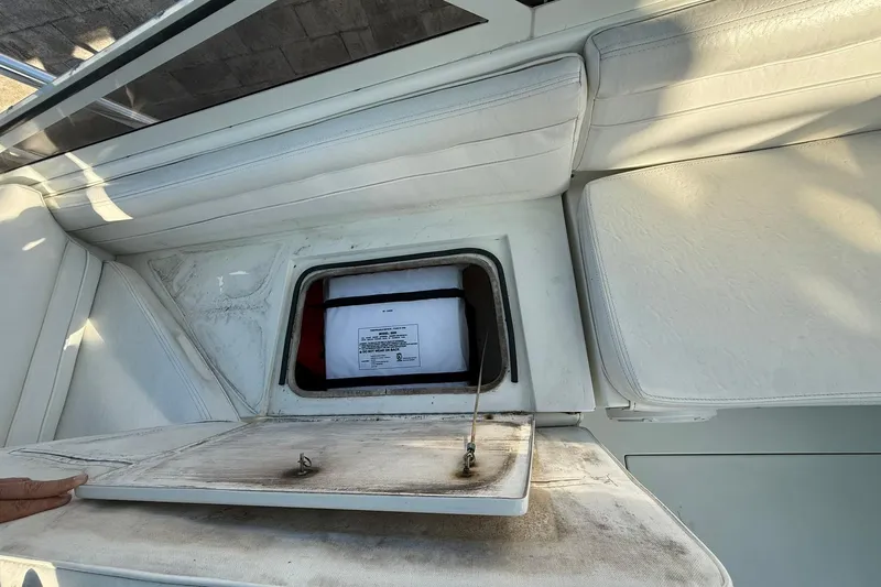 Reel Dreamz Yacht Photos Pics 1998 Contender 35 Express boat interior storage compartment with open hatch.