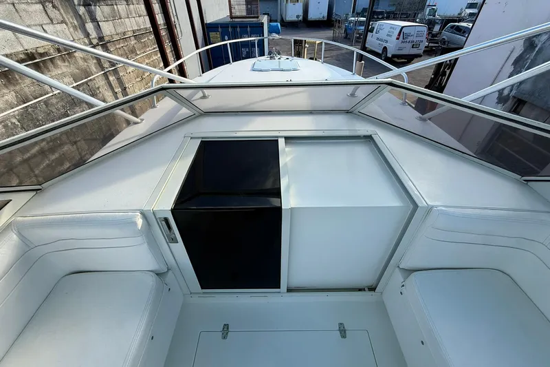 Reel Dreamz Yacht Photos Pics 1998 Contender 35 Express boat interior with white seating and storage compartments.
