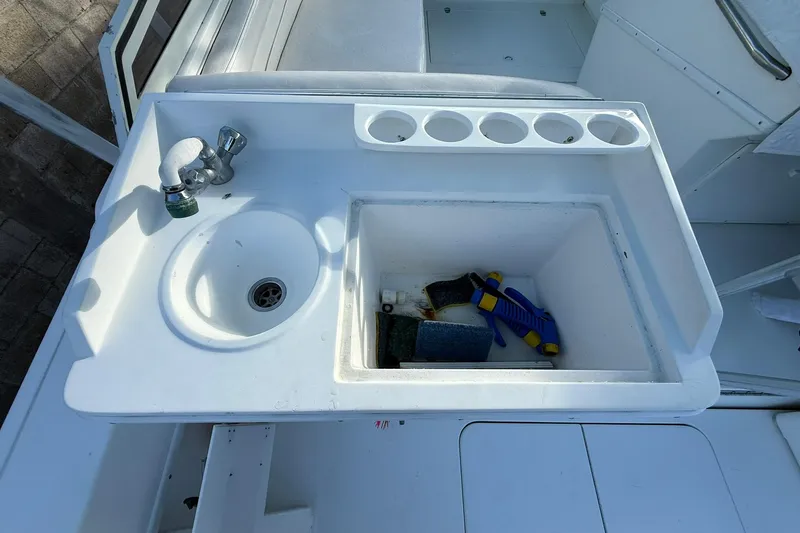 Reel Dreamz Yacht Photos Pics Boat sink and storage area on a 1998 Contender 35 Express.