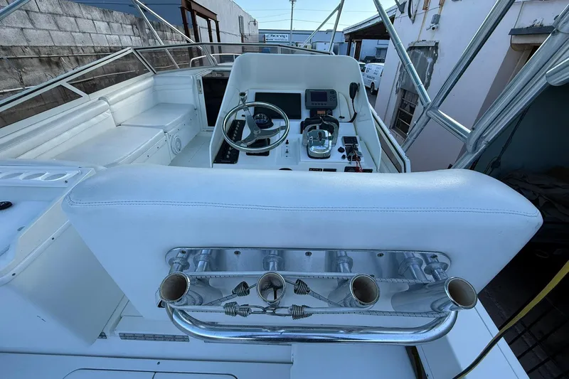 Reel Dreamz Yacht Photos Pics 1998 Contender 35 Express boat cockpit with steering wheel and controls.