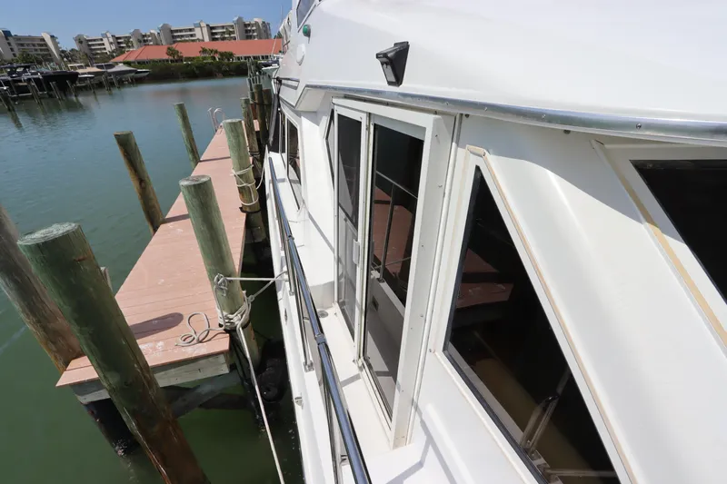 Fitz Perfectly Yacht Photos Pics 2001 Navigator 4800 CLASSIC yacht docked at marina with waterfront view.