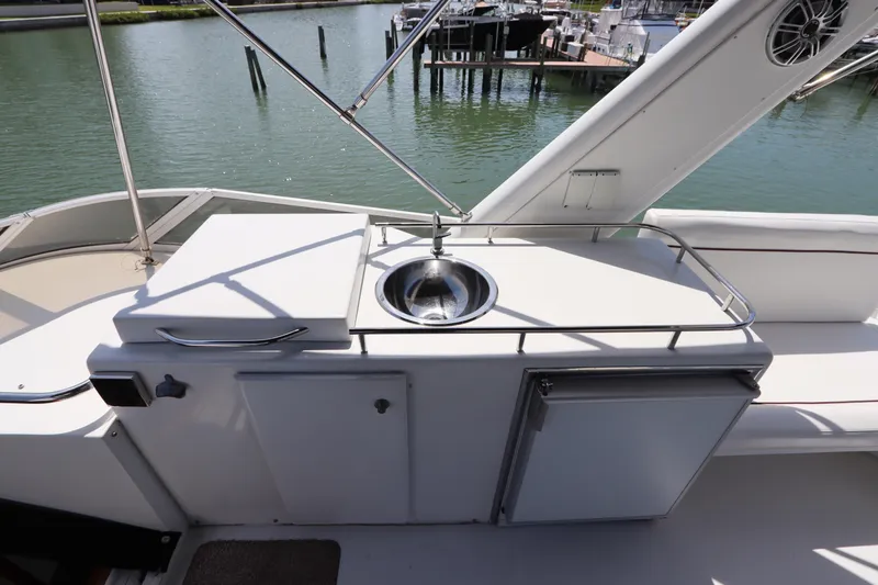 Fitz Perfectly Yacht Photos Pics Outdoor sink and storage area on 2001 Navigator 4800 CLASSIC yacht deck.