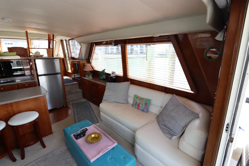 Fitz Perfectly Yacht Photos Pics Interior of 2001 Navigator 4800 CLASSIC yacht with cozy seating and modern kitchen.