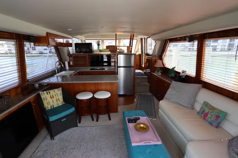 Fitz Perfectly Yacht Photos Pics Interior of 2001 Navigator 4800 CLASSIC yacht with modern kitchen and cozy seating area.