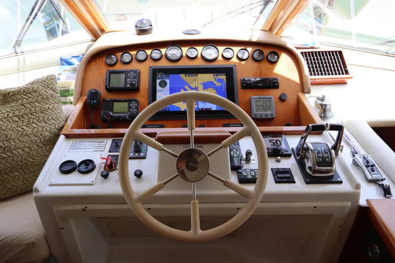 Fitz Perfectly Yacht Photos Pics Navigator 4800 CLASSIC 2001 yacht helm with steering wheel and navigation instruments.