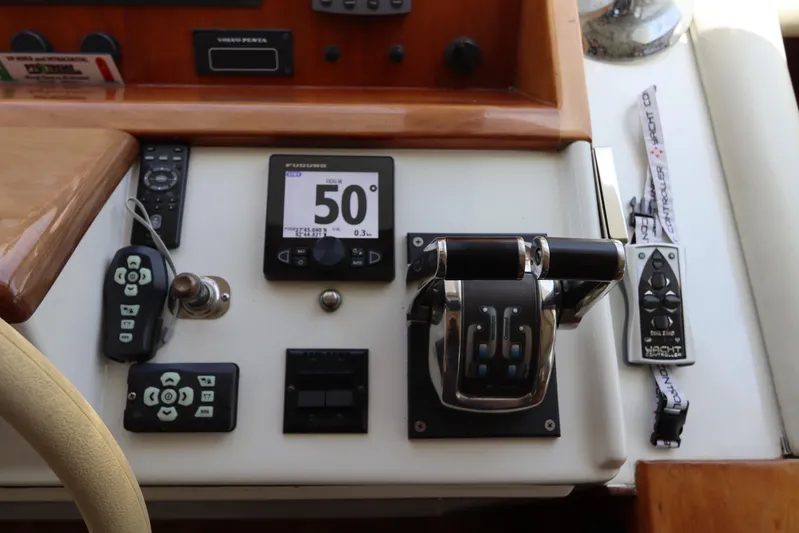 Fitz Perfectly Yacht Photos Pics Control panel of a 2001 Navigator 4800 CLASSIC yacht with various instruments and controls.