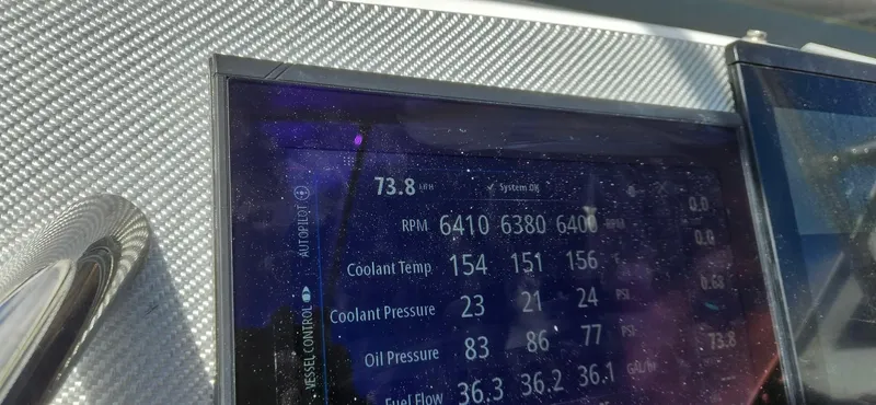  Yacht Photos Pics Dashboard display of a 2006 Fountain 38 Express Cruiser showing RPM, coolant, and oil pressure.