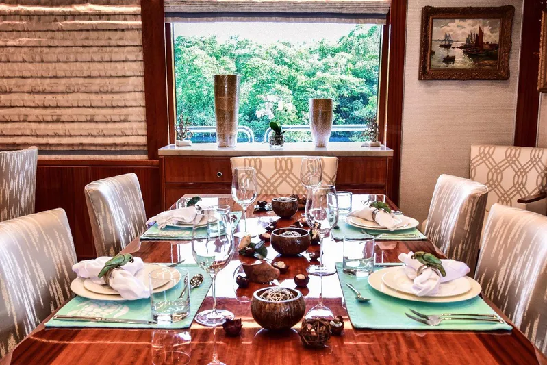Renaissance Yacht Photos Pics Luxurious dining area on 2016 Hargrave 116 RPH yacht, elegantly set table with scenic view.