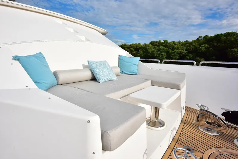 Renaissance Yacht Photos Pics Luxurious seating area on 2016 Hargrave 116 RPH yacht deck with blue cushions.