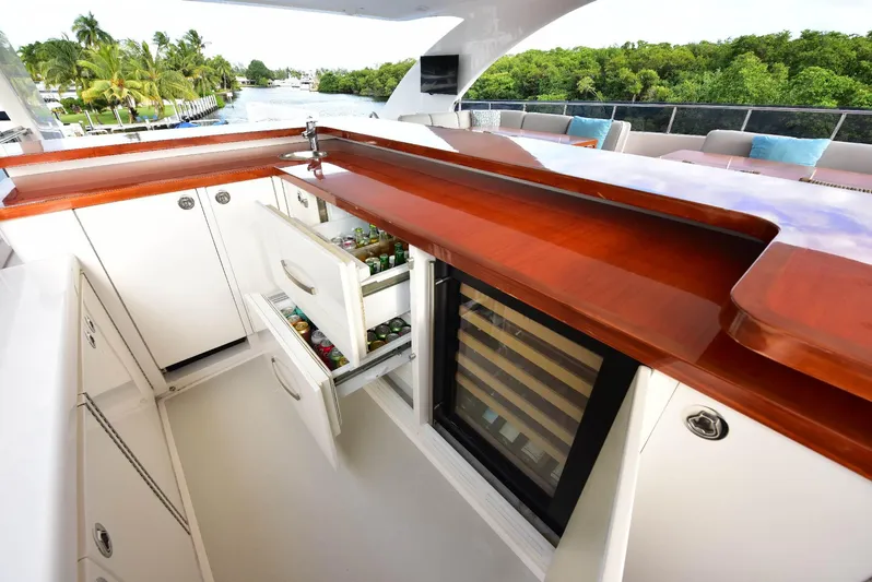 Renaissance Yacht Photos Pics Luxurious 2016 Hargrave 116 RPH yacht bar with open fridge and scenic view.