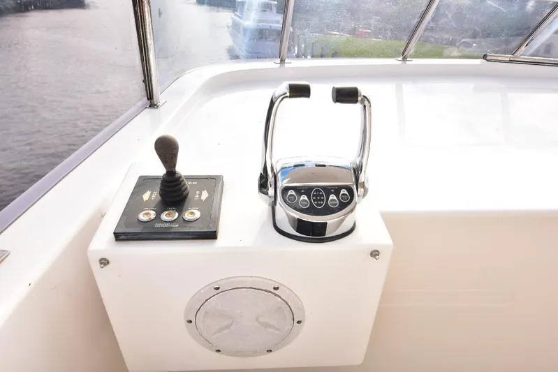 Renaissance Yacht Photos Pics Control panel of 2016 Hargrave 116 RPH yacht with throttle and joystick.