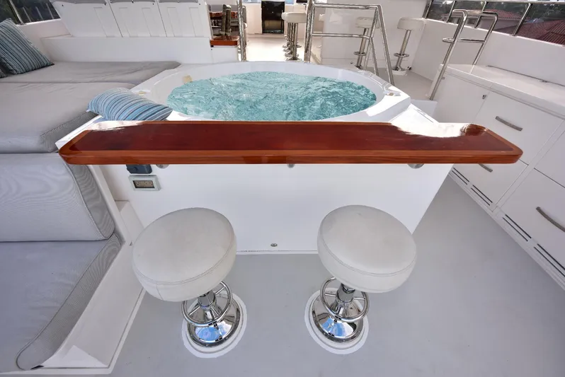 Renaissance Yacht Photos Pics Luxurious 2016 Hargrave 116 RPH yacht with jacuzzi and bar stools on deck.
