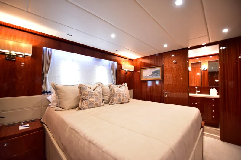 Renaissance Yacht Photos Pics Luxurious bedroom interior of 2016 Hargrave 116 RPH yacht with elegant wood finishes.