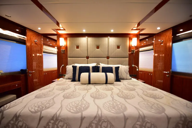 Renaissance Yacht Photos Pics Luxurious bedroom interior of 2016 Hargrave 116 RPH yacht with elegant bedding and wood paneling.