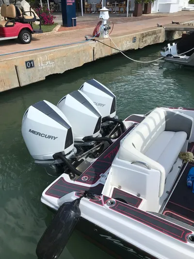  Yacht Photos Pics 2015 Nor-Tech 340 Sport boat with triple Mercury engines docked in marina.