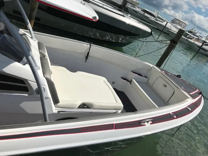  Yacht Photos Pics 2015 Nor-Tech 340 Sport boat docked, featuring sleek design and comfortable seating.