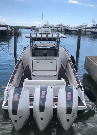  Yacht Photos Pics 2015 Nor-Tech 340 Sport boat with triple engines docked in a marina.
