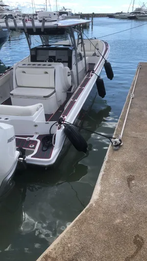  Yacht Photos Pics 2015 Nor-Tech 340 Sport boat docked at marina with fenders and outboard motor.