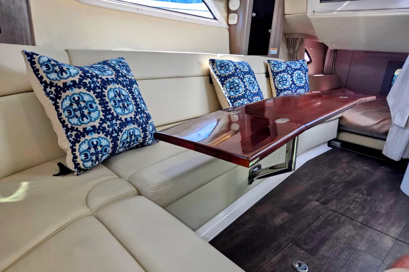 Willowbender Yacht Photos Pics Luxurious interior of 2019 Regal 35 Sport Coupe with elegant seating and decorative pillows.