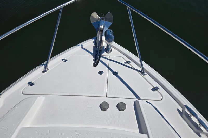Willowbender Yacht Photos Pics Bow of 2019 Regal 35 Sport Coupe with anchor and railing.