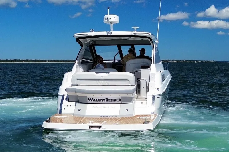 Willowbender Yacht Photos Pics 2019 Regal 35 Sport Coupe cruising on open water under a clear blue sky.