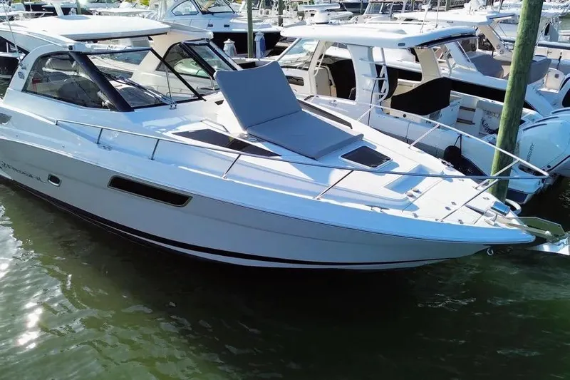 Willowbender Yacht Photos Pics 2019 Regal 35 Sport Coupe boat docked in marina, sleek design, white exterior.