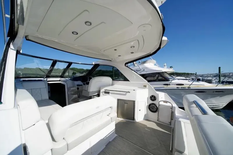 Willowbender Yacht Photos Pics 2019 Regal 35 Sport Coupe yacht interior with white seating and modern amenities.